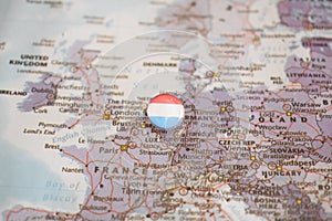 Luxembourg flag drawing pin on the map