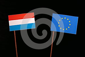 Luxembourg flag with European Union EU flag isolated on black