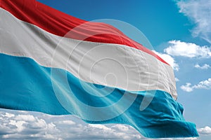 Luxembourg national flag waving blue sky background realistic 3d illustration