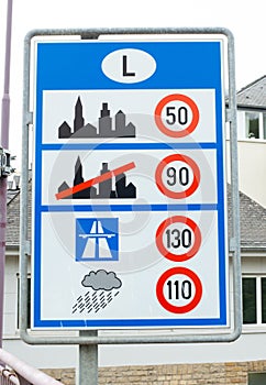 Luxembourg road sign with the speed limits, crossing frontier to the Benelux countries, traffic and transportation law at border