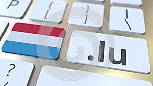 Luxembourgian domain .lu and flag of Luxembourg on the buttons on the computer keyboard. National internet related 3D