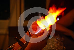 Luxor / Egypt, Africa - 9 May, 2008: Egyptian glass blower makes a demostration of making a bottle of perfume. photo