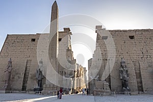 The colossal statues of Ramesses the Great and obelisk at the first pylon of Luxor Temple