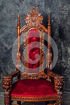 Luxurious antique armchair with gothic ornament