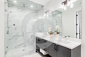 Luxurious bathroom with lights on.