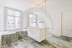 Luxurious bathroom with marble floor and bathtub