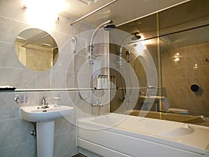 Luxurious bathroom mirrors, bathtub, basin nobody