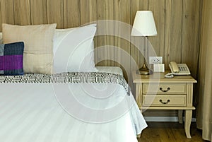 Luxurious Bedroom with Comfortable Bed, Stylish Furniture, and Soft Pillows in a Home Setting