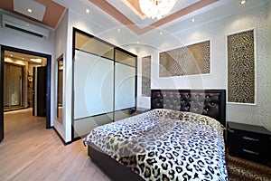 Luxurious bedroom in the Greek style with leopard photo