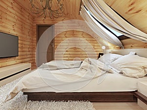 Luxurious bedroom in modern style, with a roof window in the log
