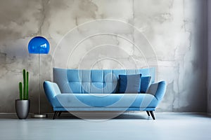 Luxurious blue velvet sofa in Modern Living Space on empty concrete wall background