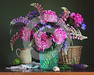 Luxurious bouquet of flowers: peonies, lupins and irises