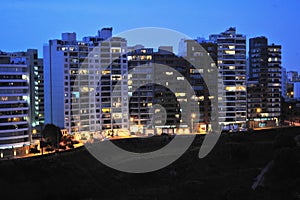 luxurious buildings at night illuminated with sky very close to the sea miraflores lima peru