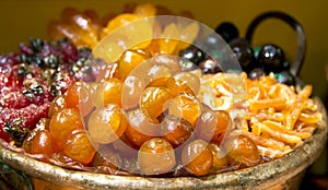 Luxurious candied fruit are in the pastry shops photo