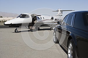 Luxurious Car And Airplane photo