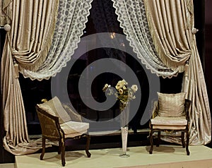 Luxurious chairs and window curtains