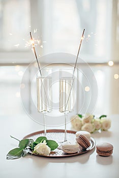 Luxurious champagne wedding party with white roses and macaron d