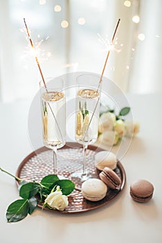 Luxurious champagne wedding party with white roses and macaron d