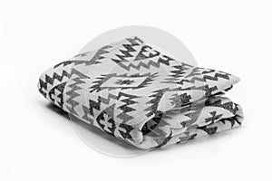 Luxurious Christmas gift, woolen throw blanket in Pendelton style on a white background.