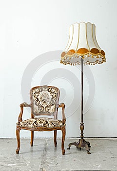 Luxurious classical vintage armchair with desk lamp