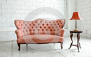 Luxurious classical vintage sofa with desk lamp