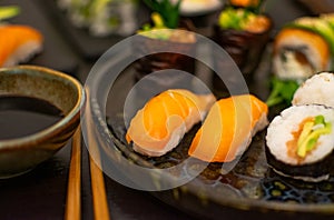 Luxurious and creative Sushi as Nigiri,Futomaki,Uramaki with chopsticks and Soja