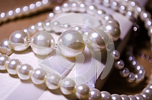 Luxurious decoration. Jewelry made of pearls. Imitation pearl jewelry. Jewelry made of pearls against the background of craft