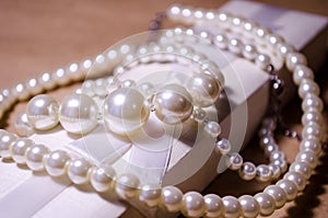 Luxurious decoration. Jewelry made of pearls. Imitation pearl jewelry. Jewelry made of pearls against the background of craft