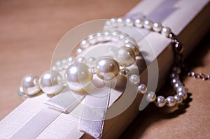 Luxurious decoration. Jewelry made of pearls. Imitation pearl jewelry. Jewelry made of pearls against the background of craft
