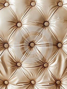 Luxurious diamond-tufted leather in a warm beige tone, featuring a plush, sophisticated texture that creates a visually