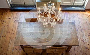 Luxurious dining room with chandelier and wooden table