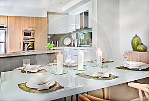 Luxurious dining room table setup near to the kitchen