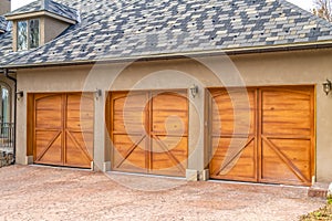 Luxurious exterior of a house with stylish brown wooden garage doors