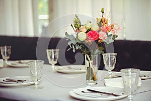 Luxurious floral arrangement of pink and white flowers fixed on the wall