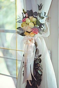 Luxurious floral arrangement of pink and white flowers fixed on the wall