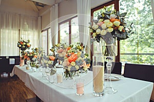 Luxurious floral arrangement of pink and white flowers fixed on the wall