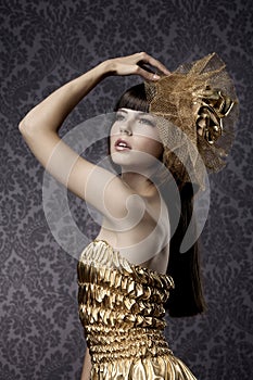 Luxurious glamorous models in gold photo