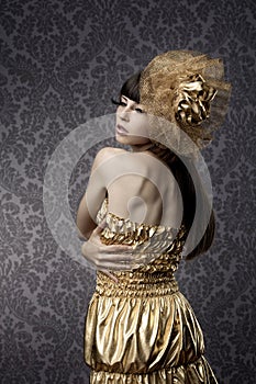 Luxurious glamorous models in gold