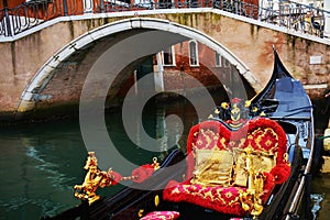 Luxurious gondola parked and iron bridge, Venice, in Italy, Europe