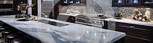 Luxurious high end kitchen with stainless appliances marble and glass til
