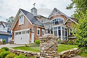 Luxurious House with Gable Roofs and Manicured Lawn, Eye-Level View photo