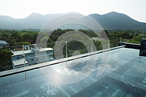 Luxurious infinity swimming pool in the morning