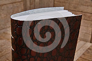 Luxurious Leather-bound Journal with Reptilian Texture on Wood