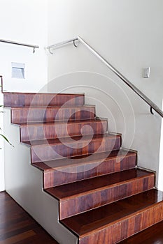 luxurious modern wooden staircase in modern house.