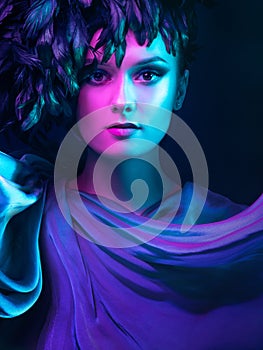 Luxurious mystical portrait, femme fatale in neon light.