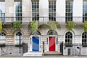 Town house with red and blue door, London, UK photo