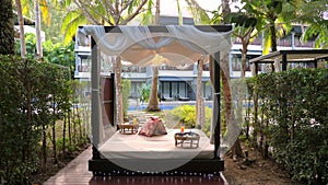 Luxurious outdoor hotel cabana draped with