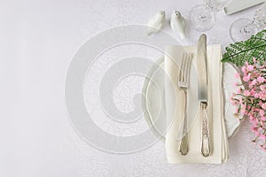 Luxurious porcelain, silverware and spring flowers