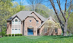 Luxurious Red Brick Home in Springtime