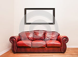 Luxurious Red Leather Couch in front of a blank wall